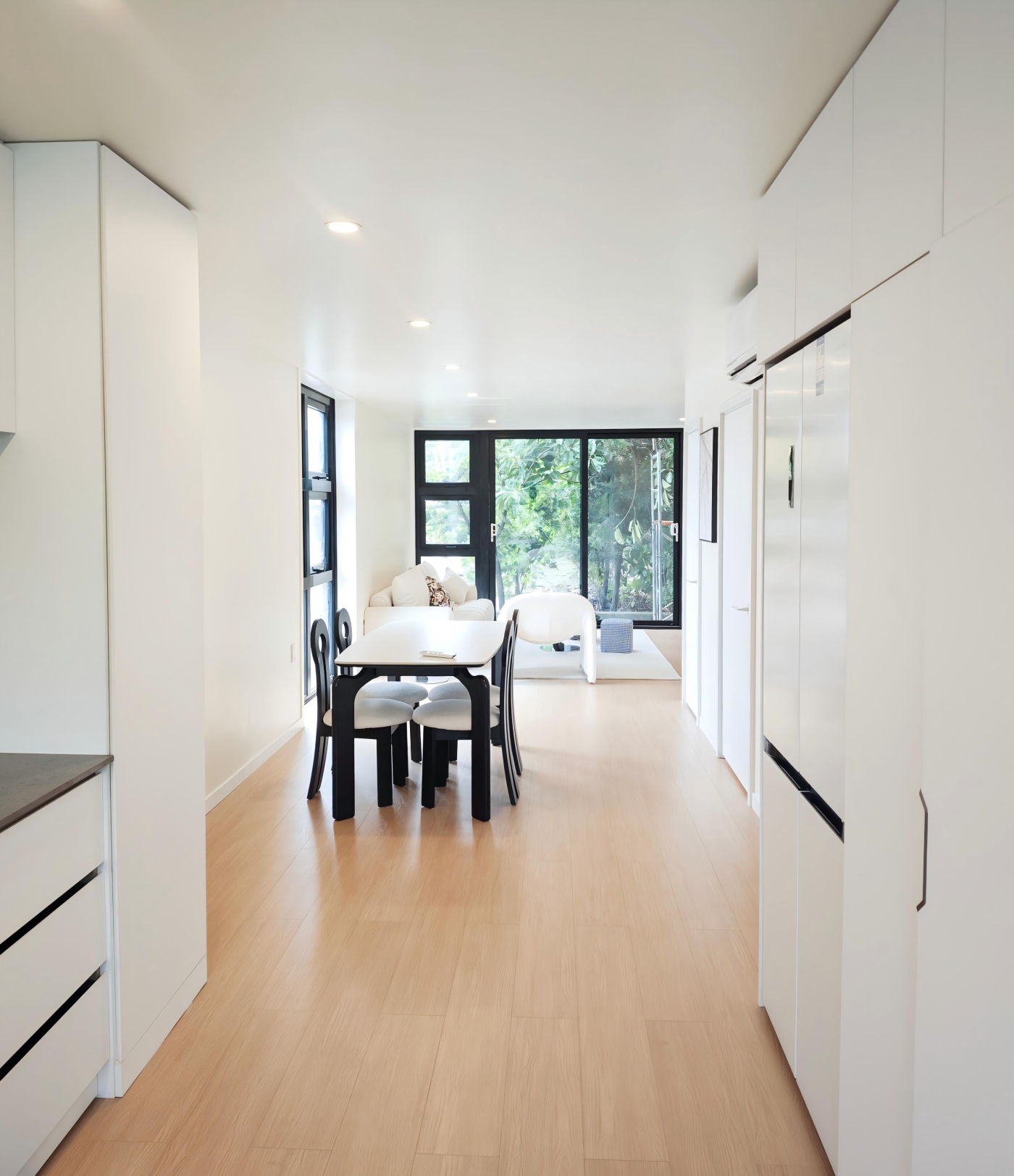 Interior — dining and living toward the balcony, Campus Edge